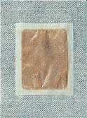 Detox Patch Chi foot patch after overnight use — visibly darkened pad
